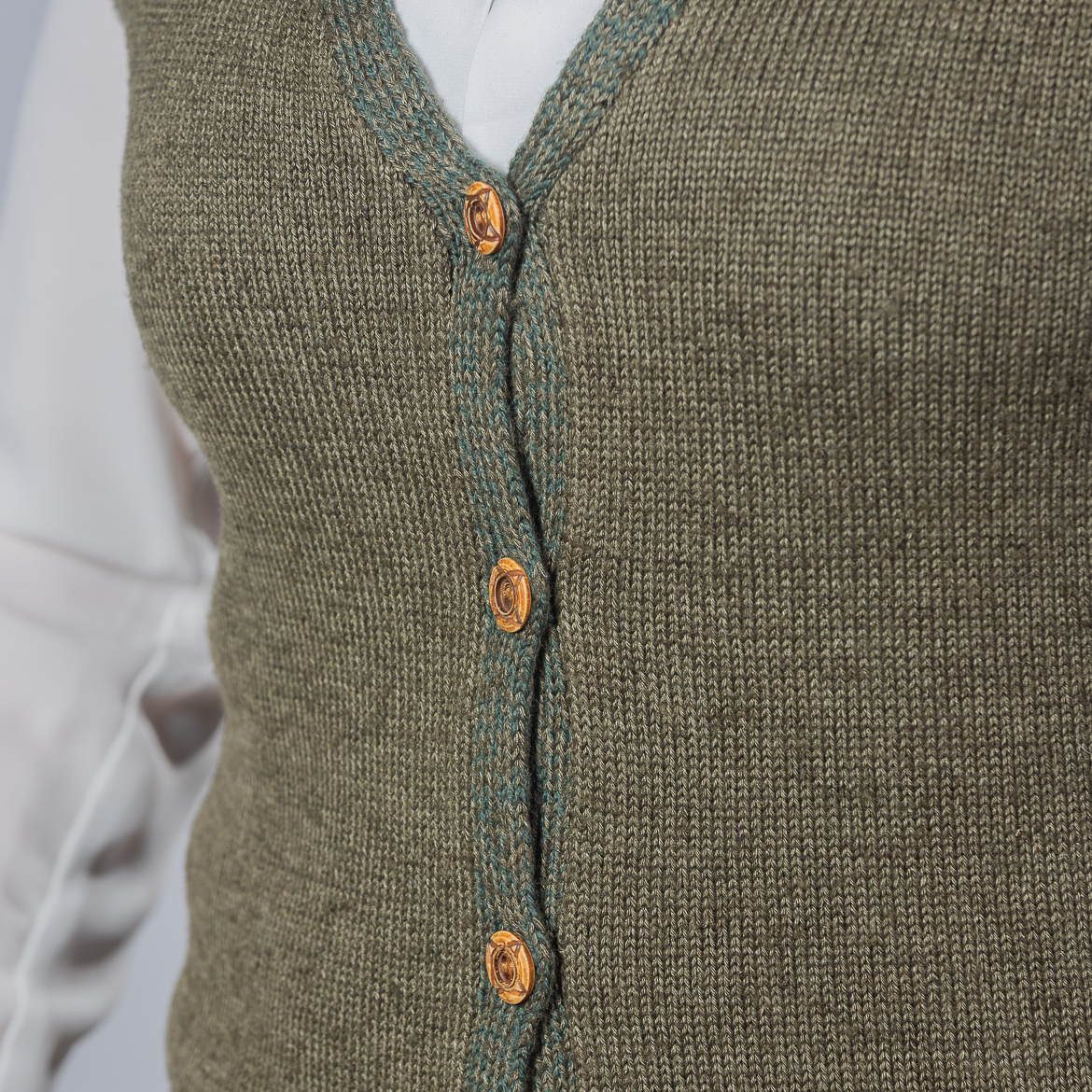 Nettle Green Vest by INESKA — close-up of wooden buttons detail
