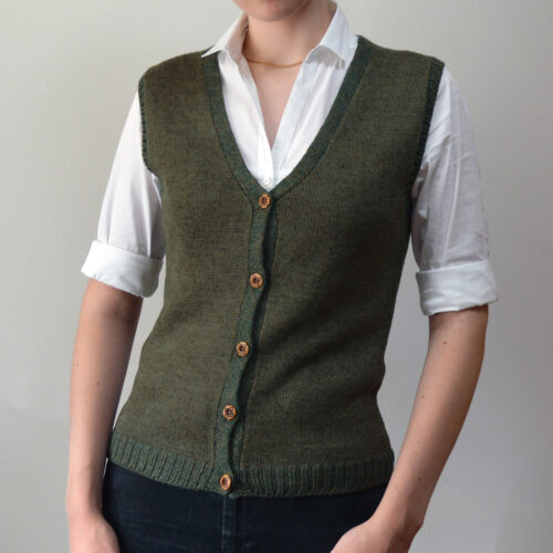 Handknitted Nettle Green Vest by INESKA — front view with white shirt