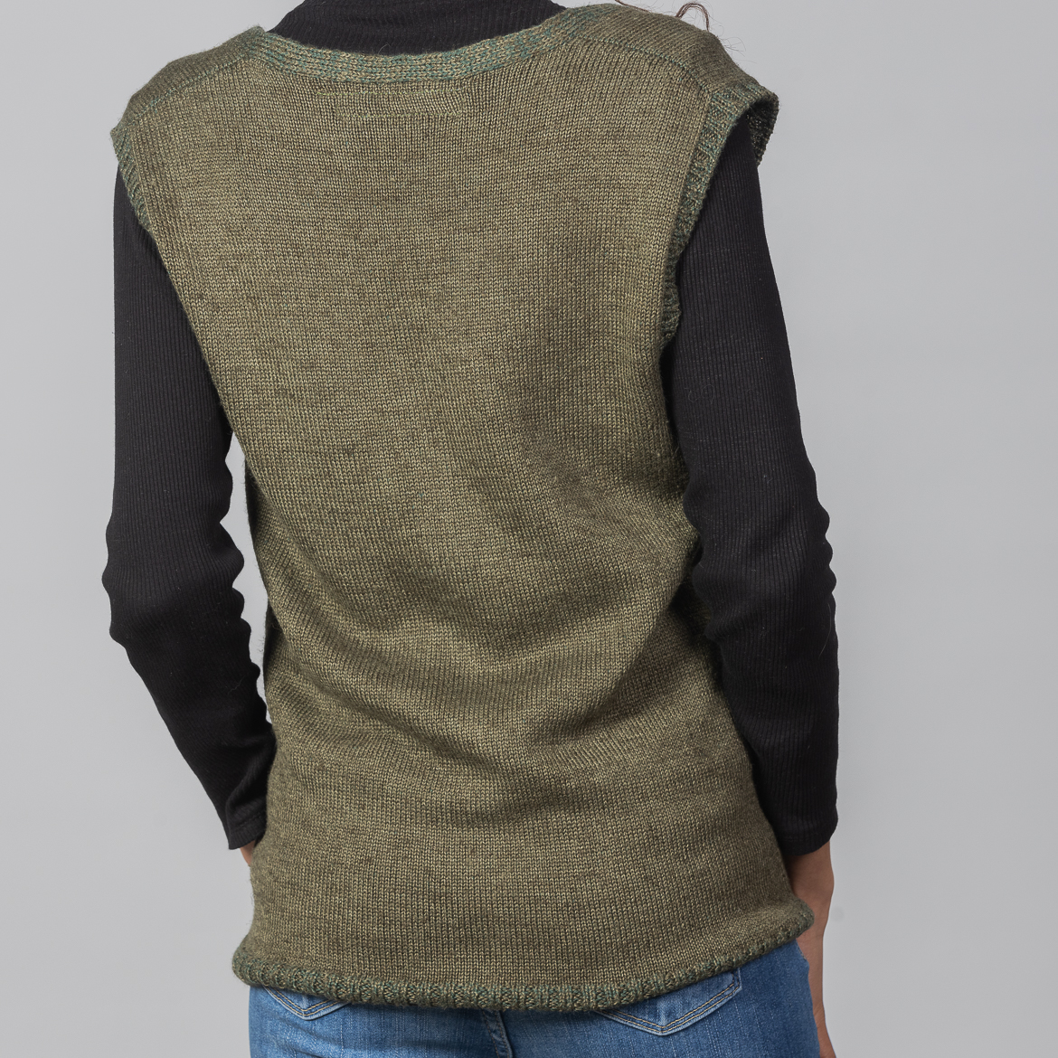 Nettle Green Vest by INESKA — back view with black turtleneck