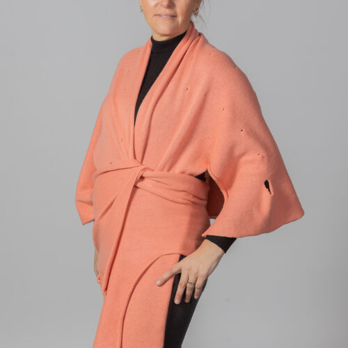 Shanty Shawl in coral by INESKA — front view styled as wrap