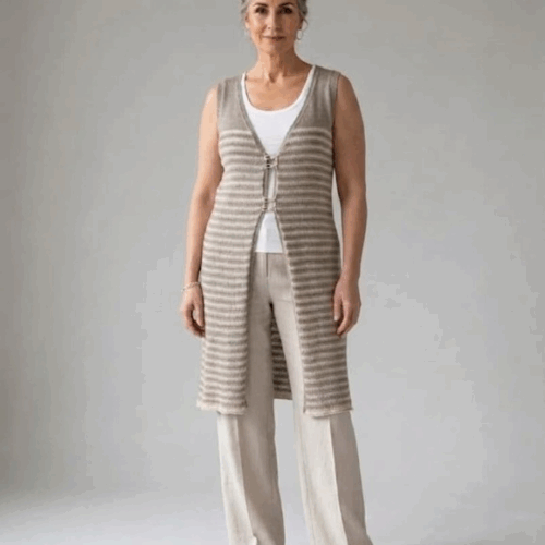 Handknitted long linen vest in natural taupe stripes, worn by a woman, front view, INESKA