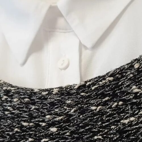 Black melange handknitted silk cashmere vest Milky Way by INESKA — texture detail with white shirt