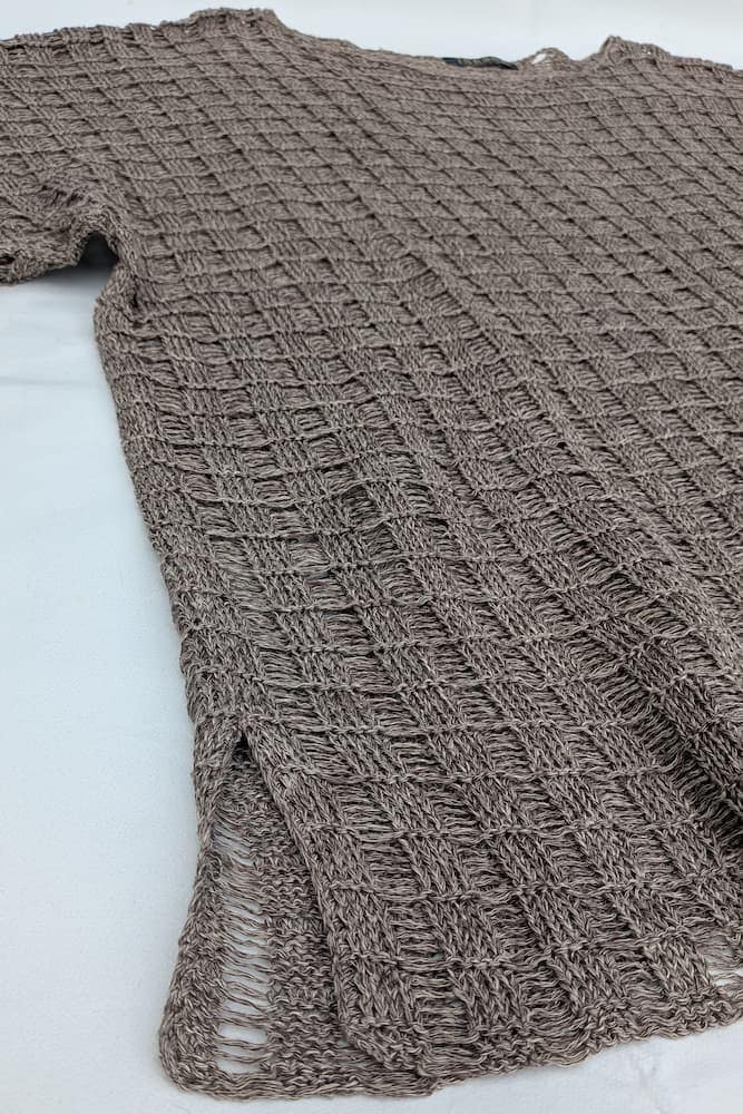 Hemp knit tunic laid flat, showing the diamond openwork texture and mélange beige-brown colour, INESKA Creative Atelier