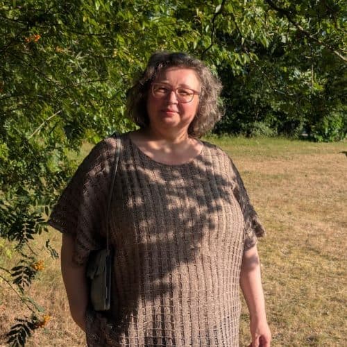 Woman wearing the hemp knit tunic outdoors, relaxed fit over jeans, INESKA Creative Atelier