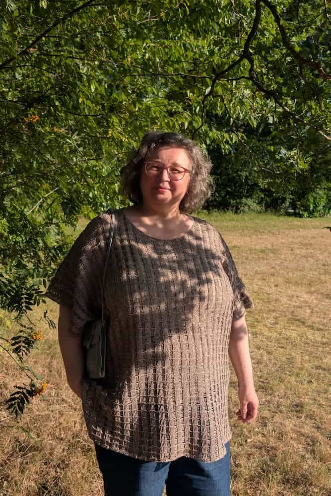 Woman wearing the hemp knit tunic outdoors, relaxed fit over jeans, INESKA Creative Atelier